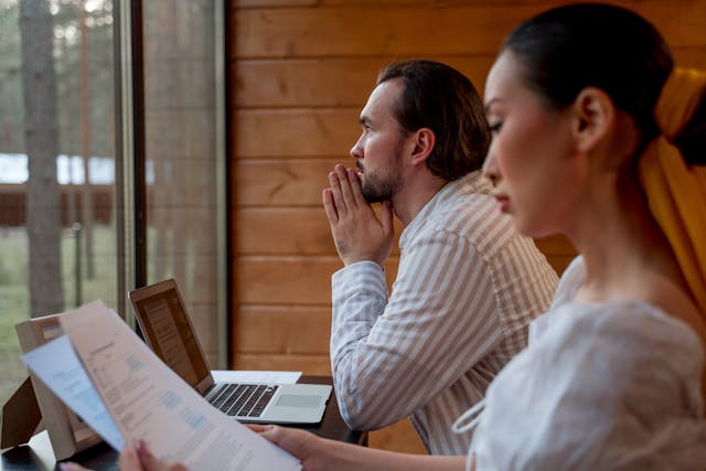 Greg Lynch reviewing a retirement plan with clients